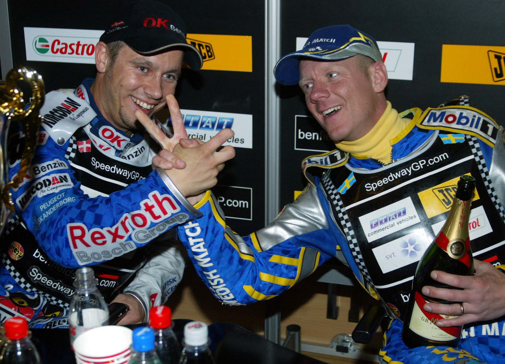 Celebrating his first Speedway GP world title in 2003 - with outgoing champion Tony Rickardsson
