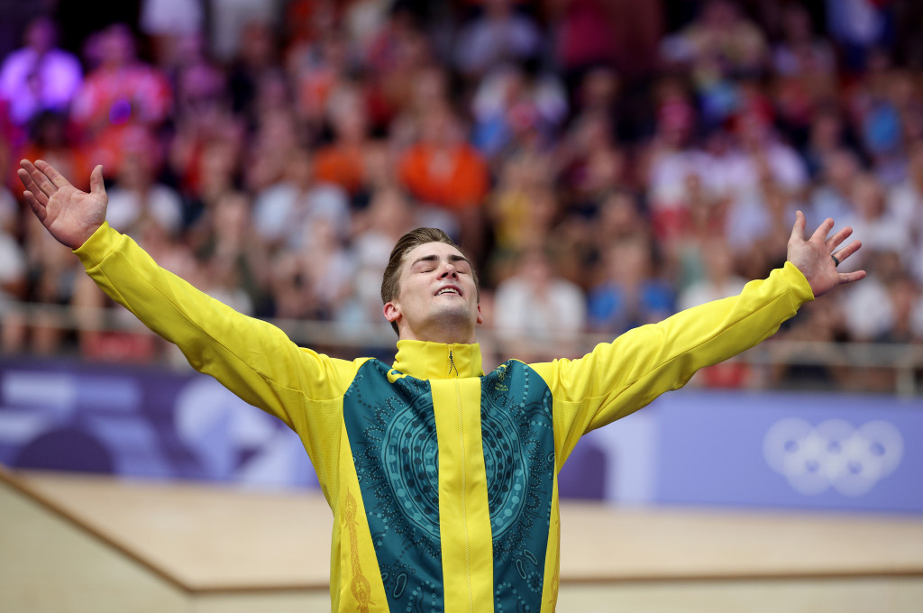 Bronze medalist Matthew Glaetzer (AUS) celebrates on the podium after the Men's Keirin