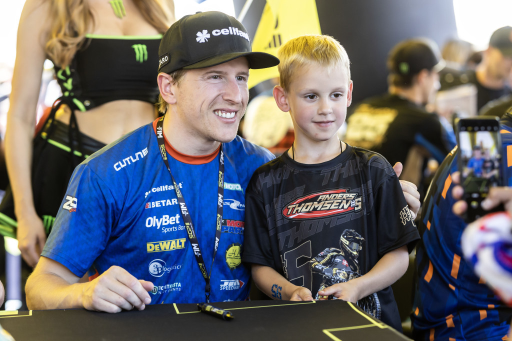 A young fan meets Latvia's Andzejs Lebedevs. PHOTO: Taylor Lanning
